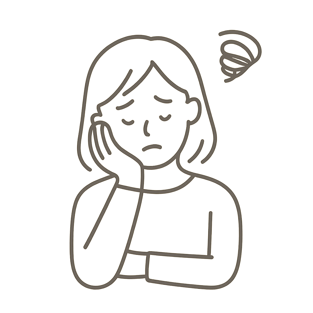 頭を悩ませてるママの画像